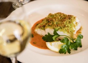 Main course: A Fillet of fish and a glass of wine at Outside Monks Ballyvaughan Seafood Restaurant & Bar, Co Clare